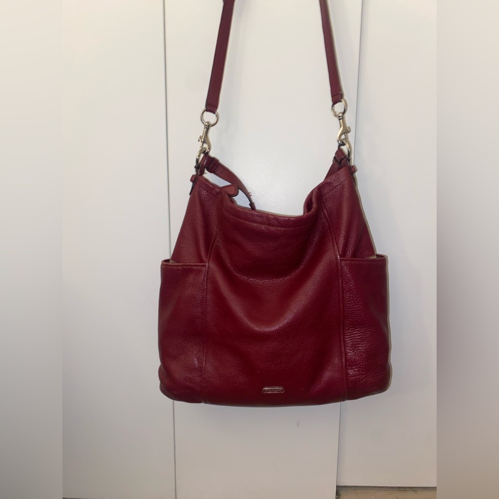 Deep red Coach bag.